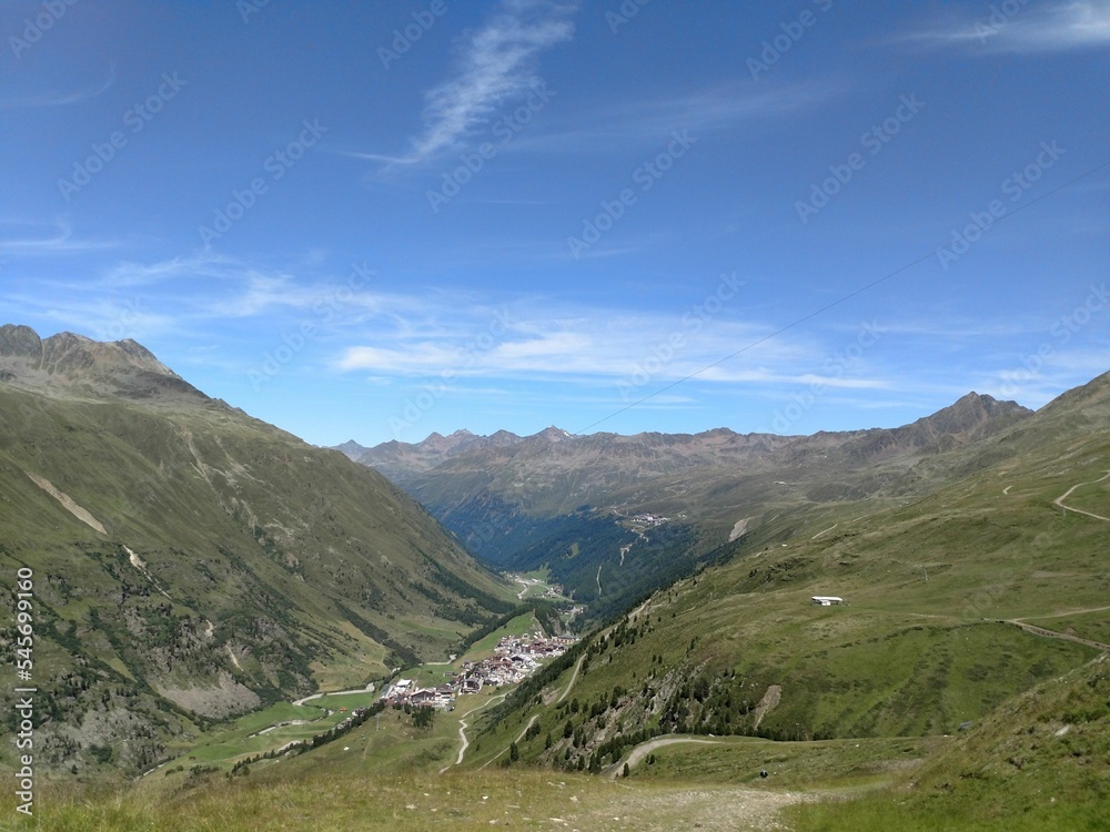 Fototapeta premium Beautiful mountainous landscape with green grass on a sunny day