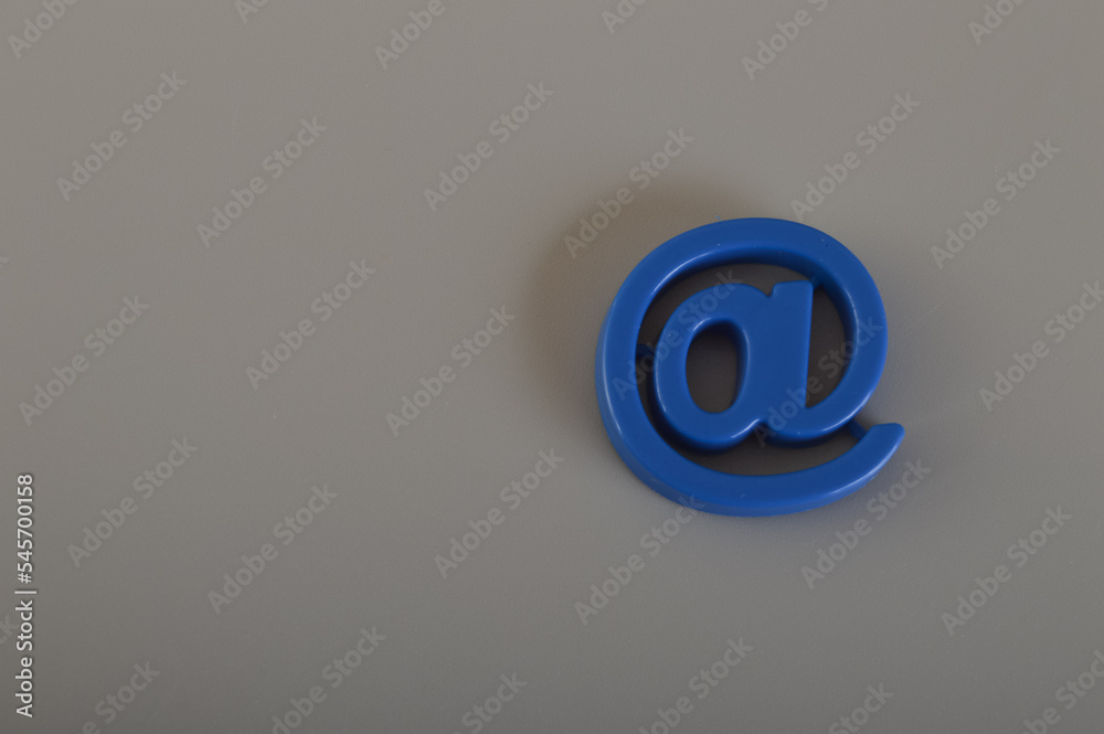 Email address symbol isolated a grey background. Email marketing and communication concept. Email address symbol isolated a grey background. Email marketing and communication concept.