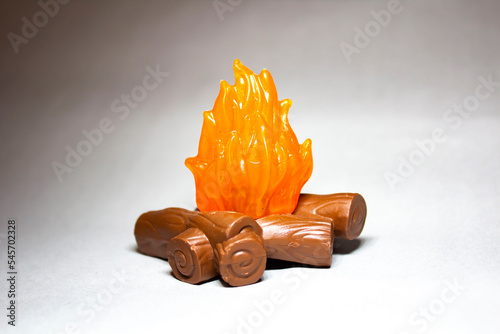 Plastic figurine bonfire with bokeh effect