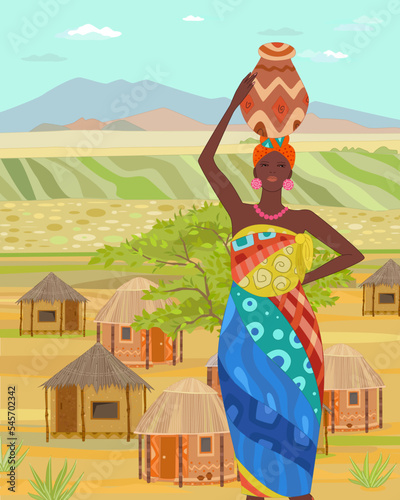 An African girl in costume, carrying water jugs on her head, sta