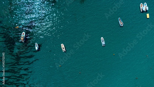 Aerial of Rondinara's beach with ships in the sea