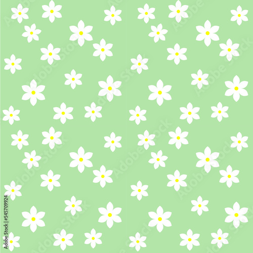 Lots of white floral fabric pattern on green background.