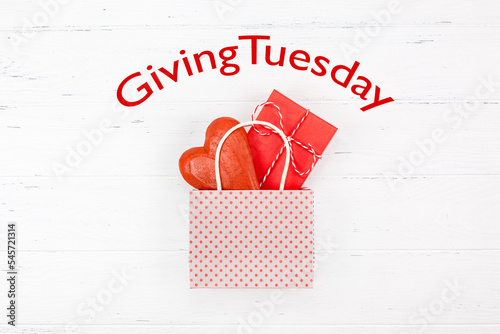 Giving Tuesday concept with heart and gift in bag