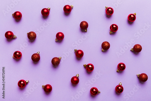 Christmas composition. a pattern of christmas balls on colored background. Flat lay, top view New year decor