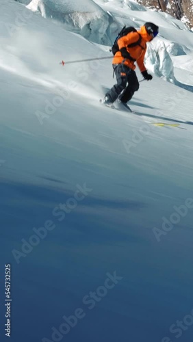 Person skiing in the snowy mountains