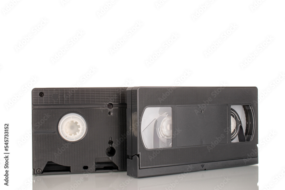Two video cassettes, macro, isolated on white background.