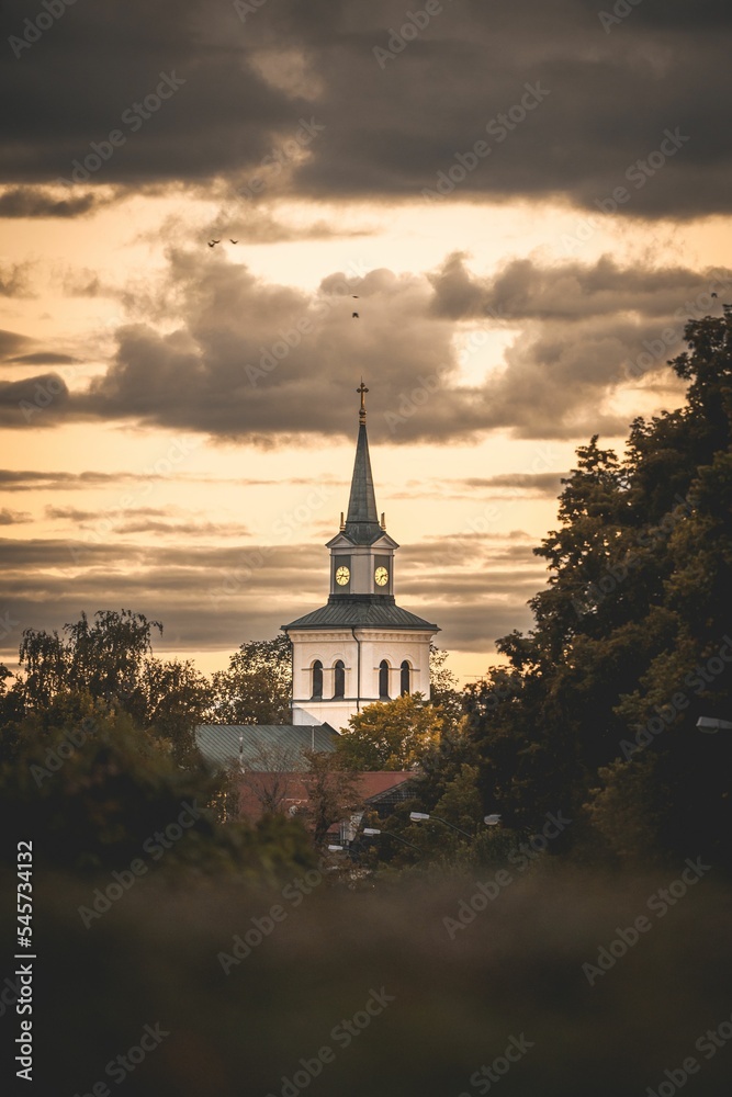 Outdoor view of the Church  and forest landscape in Vimmerby, Sweden during sunset
