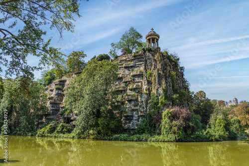 Sibyl temple on the hill and lake in Buttes Chaumont Park, Paris, France. photo
