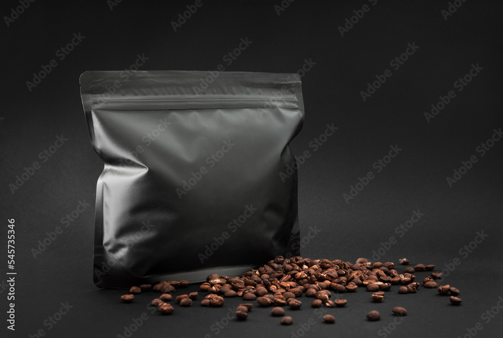 Premium specialty coffee foil bag mockup, two dark packages with beans and blank label for branding template and presentation design