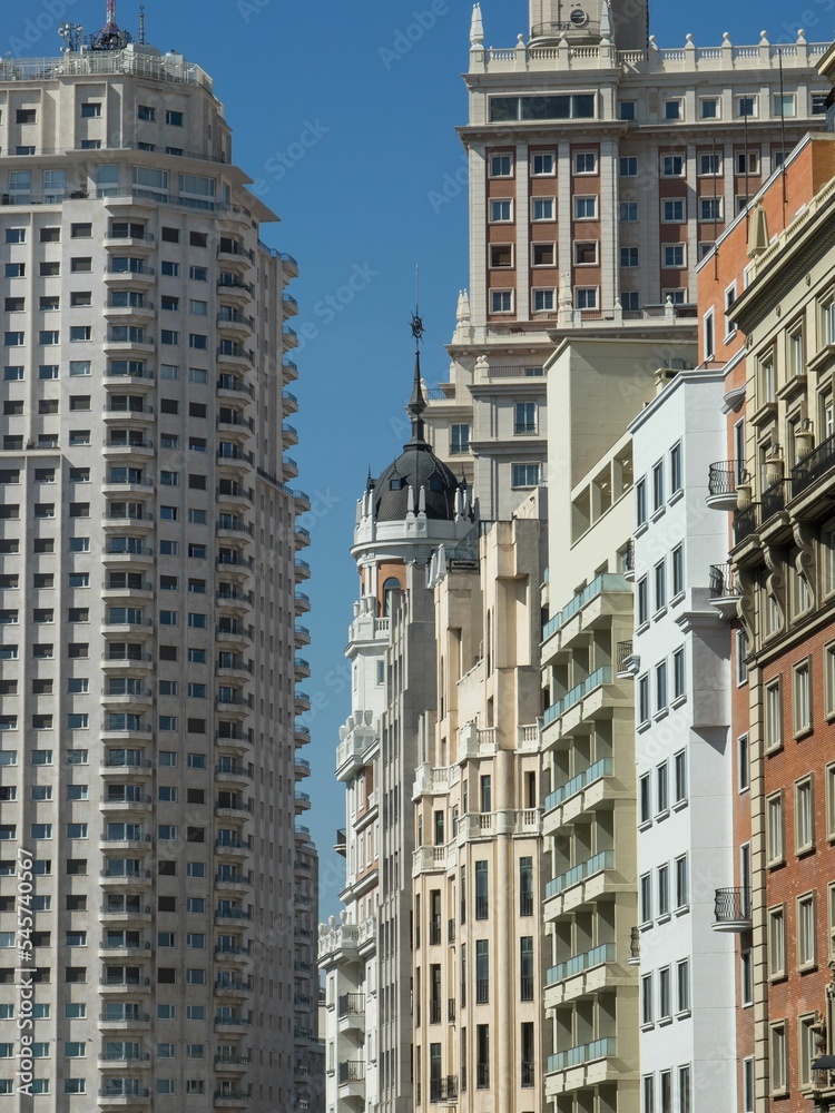 Beautiful view of the buildings on Calle Gran Via street in Madrid, Spain.