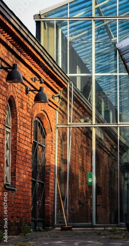 Vertical of the Wanha Satama venue with red brick walls and glass building in Helsinki, Finland photo