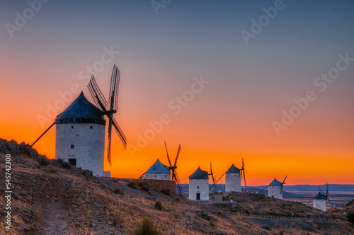 Consuegra windmills at sunset in the province of Toledo, Spain photo