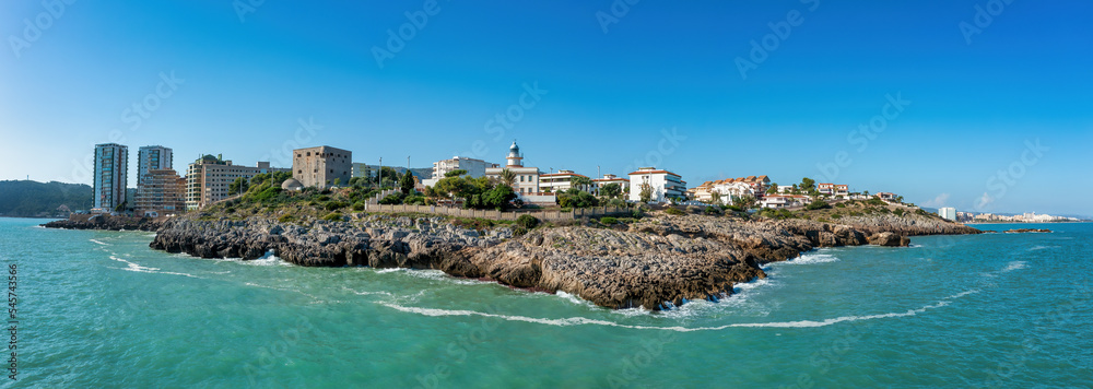 Coastal Panorama view of Oropesa del Mar, Spain, showing Torreon del Rey, guard tower and lighthouse