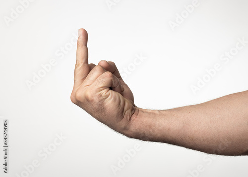 A man's hand and arm on a nuclear white background, showing a gesture of greeting approval or positivity.