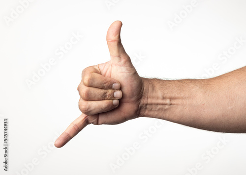 A man's hand and arm on a nuclear white background, showing a gesture of greeting approval or positivity.