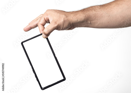 Hand and arm of a man holding a cell phone with a blank screen on a nuclear white background.