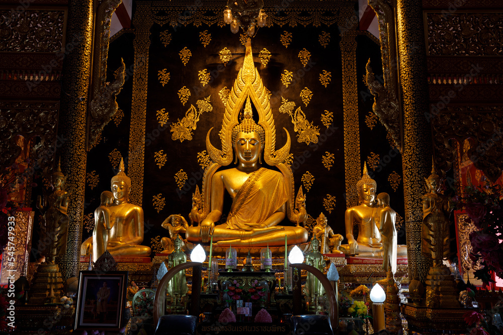 Golden buddha inside the church At Wat Phra That Suthon Mongkhon Khiri, Den Chai District, Phrae Province, Thailand