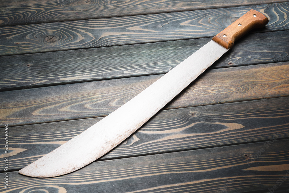 Sharp machete on the old table top view background. Stock Photo | Adobe ...