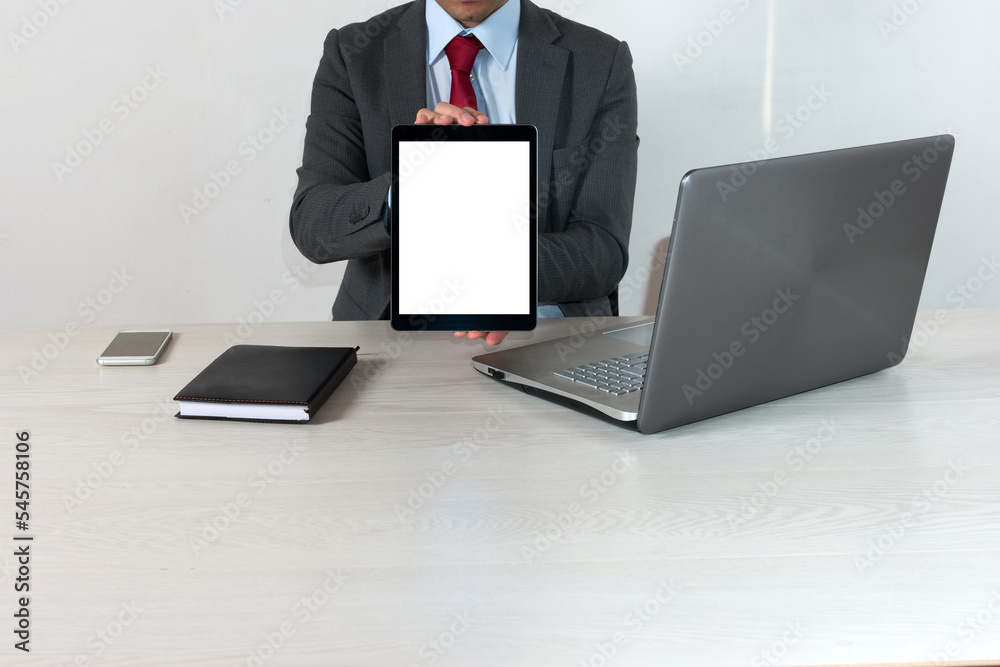 Businessman holding a tablet Businessman holding a tablet