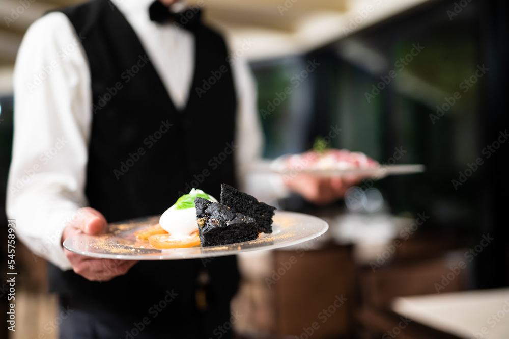 Waiter holdingdishes ready to be served