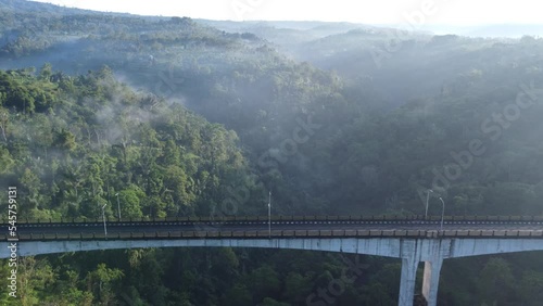 Aerial Tukad Bangkung Bridge Pelaga Morning Sunrise. The highest bridge in Asia. photo