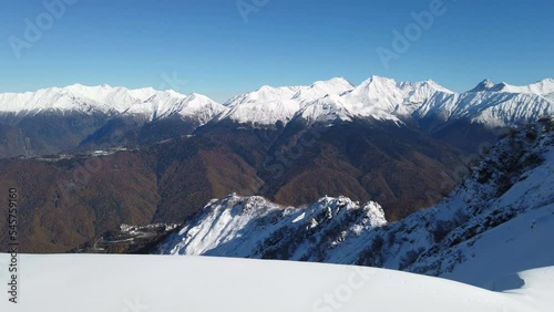 Beautiful mountain landscape in winter. First snow on the branches. Panoramic view from Alpaca Gazprom Resort. Late autumn.
