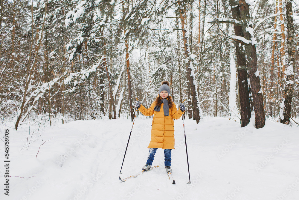 Girl skiing in the forest