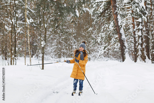 Girl skiing in the forest
