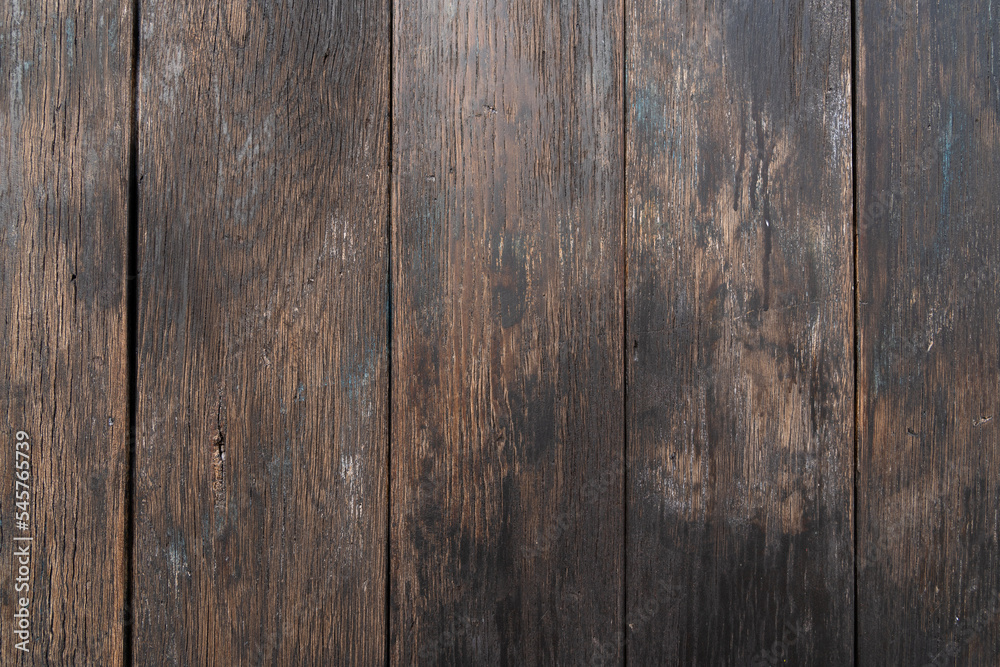 Background with old brown vertical wooden boards Background with old brown vertical wooden boards