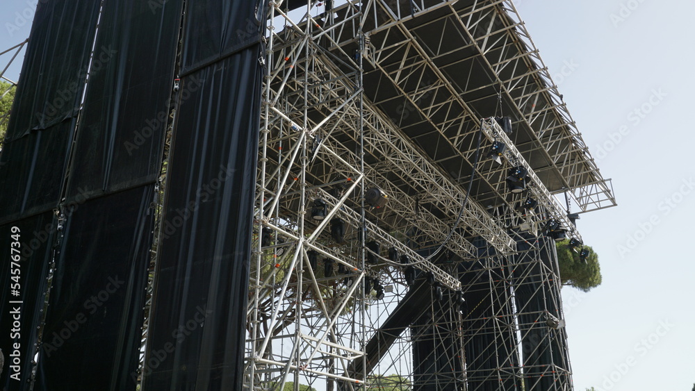 Ostia Antica, Rome, Italy - July 09, 2022, detail of a scaffolding for summer concerts in the Roman Theater within the archaeological area of Ostia Antica.