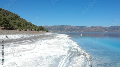 drone footage moving forward slowly at beach of salda lake, burdur, turkey