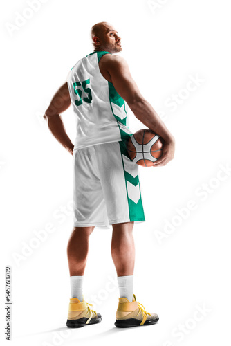Basketball. Professional basketball player standing with the ball in his hand. On a white background. Back view. Sport. Isolated © Ruslan Shevchenko