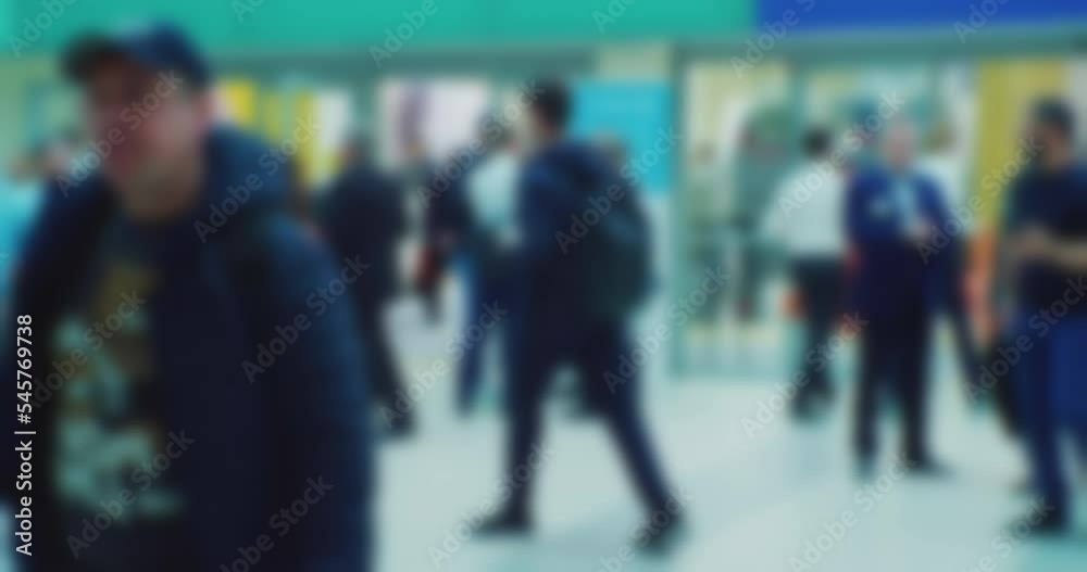 modern business life. blurred silhouettes of unrecognizable people moving fast inside a modern building.modern urban environment.blurred background on the theme of business. modern business life. blurred silhouettes of unrecognizable people moving fast inside a modern building.modern urban environment.blurred background on the theme of business.