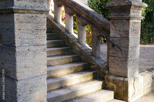 closeup of an old medieval stone staircase in the sunlight as an entrance to a castle