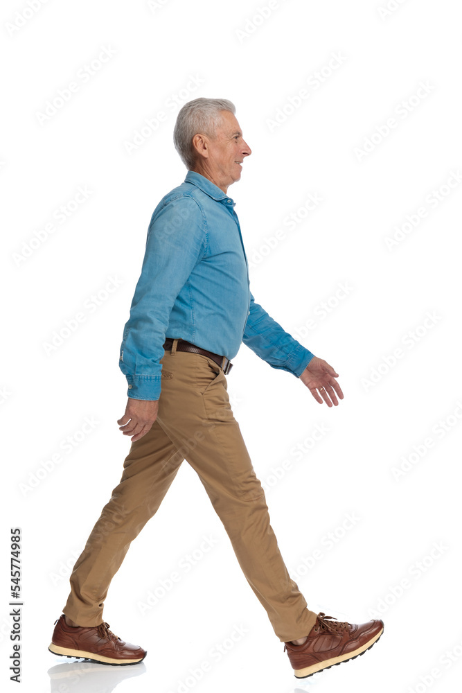 side view of handsome old man looking to side and stepping side view of handsome old man looking to side and stepping