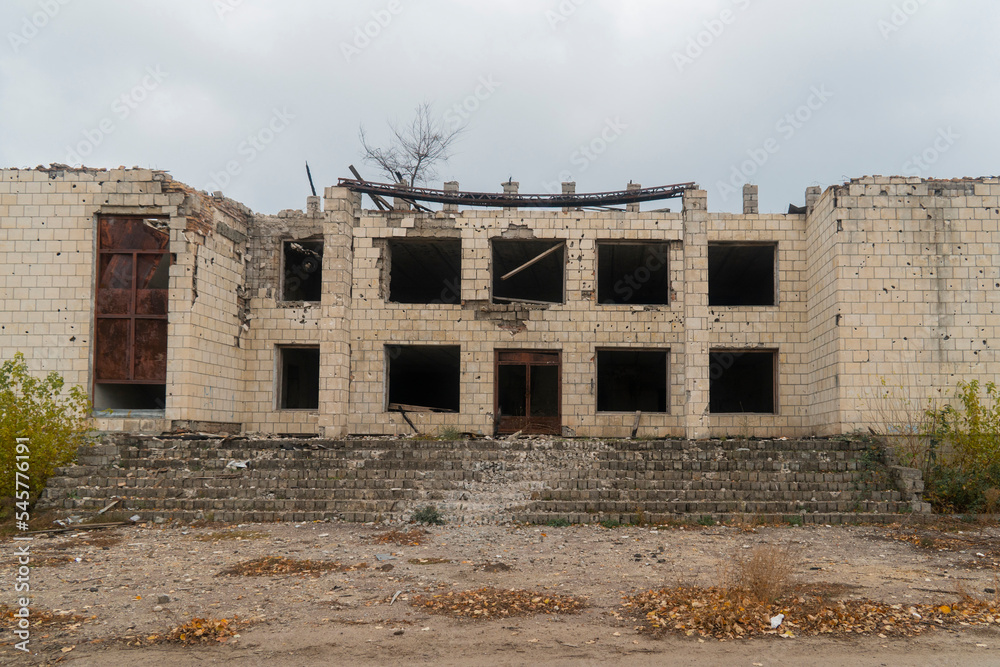 War in Ukraine. 2022 Russian invasion of Ukraine. Administrative building damaged by shelling. Destruction of infrastructure. Terror of the civilian population. War crimes