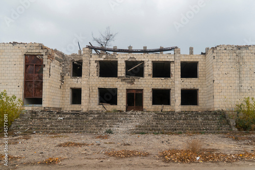 War in Ukraine. 2022 Russian invasion of Ukraine. Administrative building damaged by shelling. Destruction of infrastructure. Terror of the civilian population. War crimes