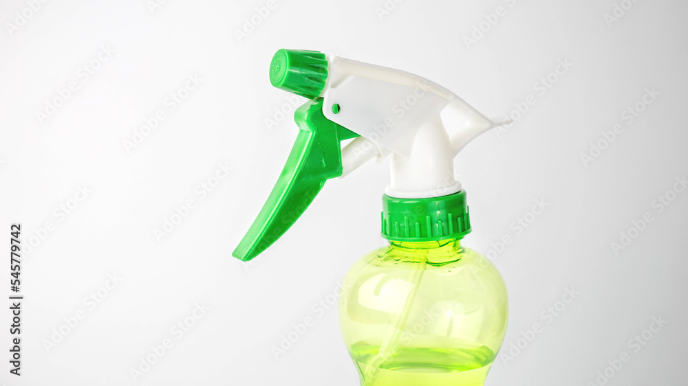 green spray bottle on white background green spray bottle on white background