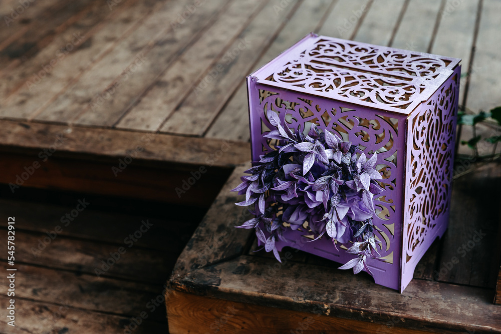 purple open gift box on wooden floor