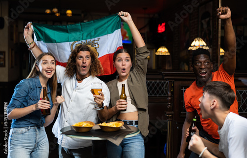 Fans of Iran team do not hide their emotions from joy in the beer bar. Iran team win