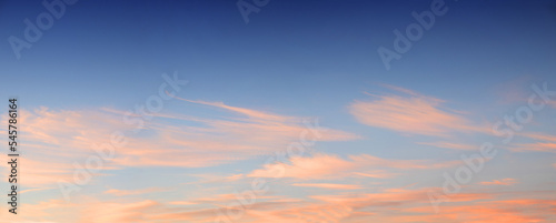 sunset sky blue and pink cirrus clouds panorama