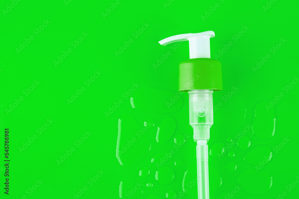 Drops of moisturized serum, essential with white dispenser on green background. Flatlay close up. organic gentle facial skincare, сleansing micellar water product cleanser Drops of moisturized serum, essential with white dispenser on green background. Flatlay close up. organic gentle facial skincare, сleansing micellar water product cleanser