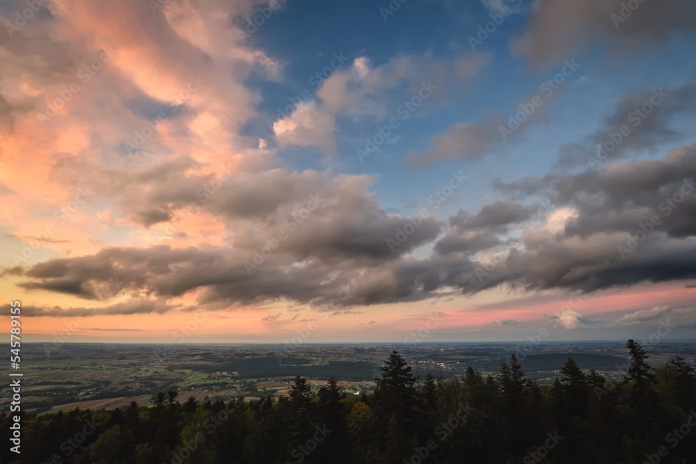Fototapeta premium Beautiful summer landscape. Colorful sky and clouds in the mountain scenery.