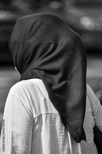 rear view of an unrecognizable woman wearing a head scarf