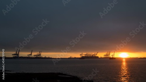 4k time lapse of sunrise over the port of Felixstowe in Suffolk, UK photo