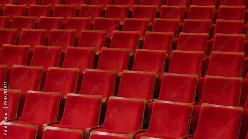 panorama over the seats of the auditorium in the concert and theater hall. red upholstery of soft chairs panorama over the seats of the auditorium in the concert and theater hall. red upholstery of soft chairs