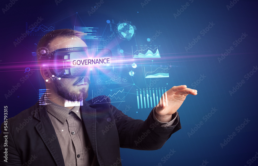 Businessman looking through Virtual Reality glasses
