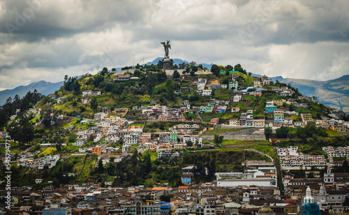 Aerial of El Panecillo Virgin Mary statue and historic center of Quito, Ecuador, drone view.