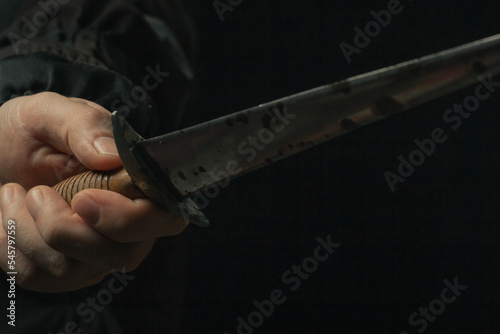 hand holding medieval antique dagger knife