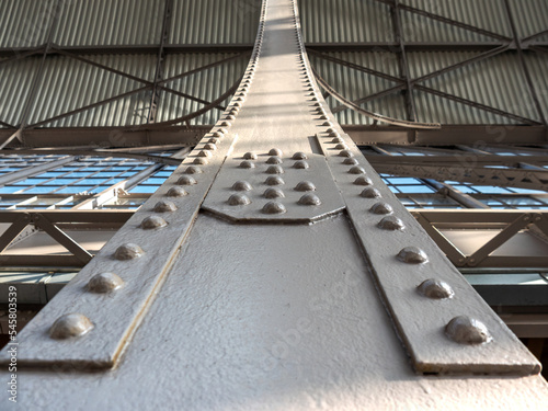 Bottom Detail View of a strong Steel Main Support Beam, Riveted Construction in a Train Station with New Paint